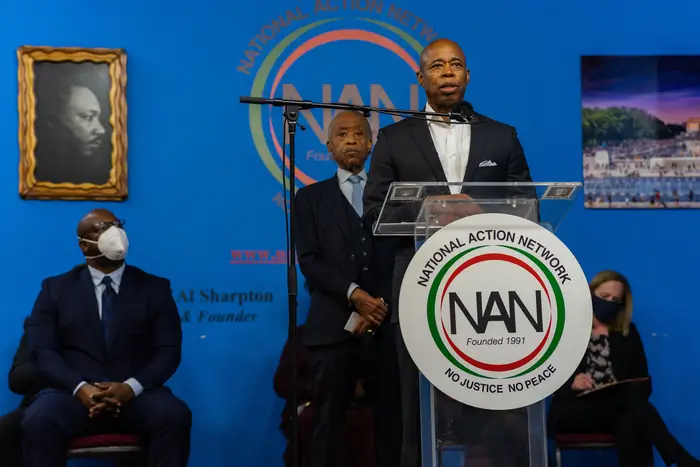 A photo of Eric Adams with Al Sharpton at a NAN event in January 2022
